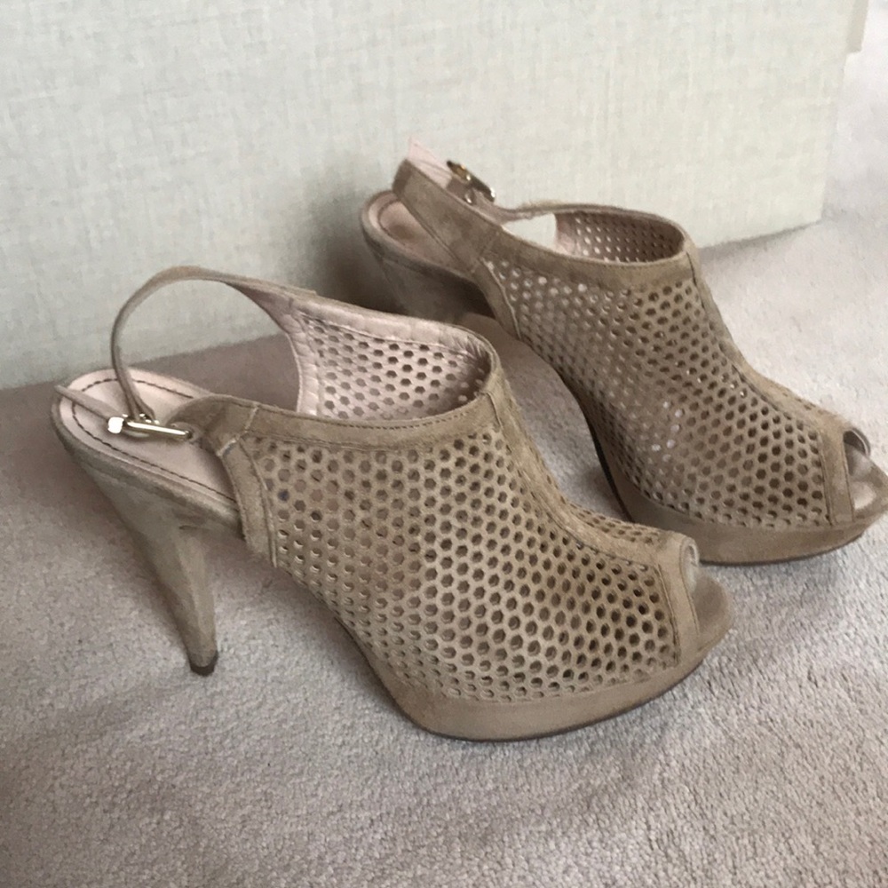 Tan suede mesh platform heels.